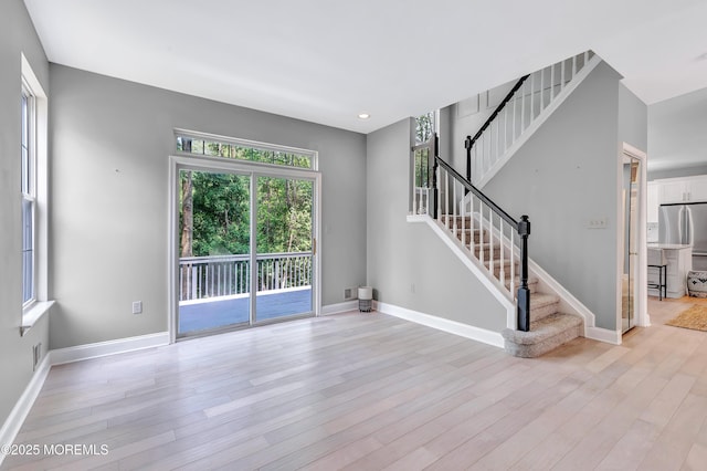 8 Armistead Ky, Colts Neck, NJ 07722 - unfurnished living room with stairway, light wood-style floors, and recessed lighting