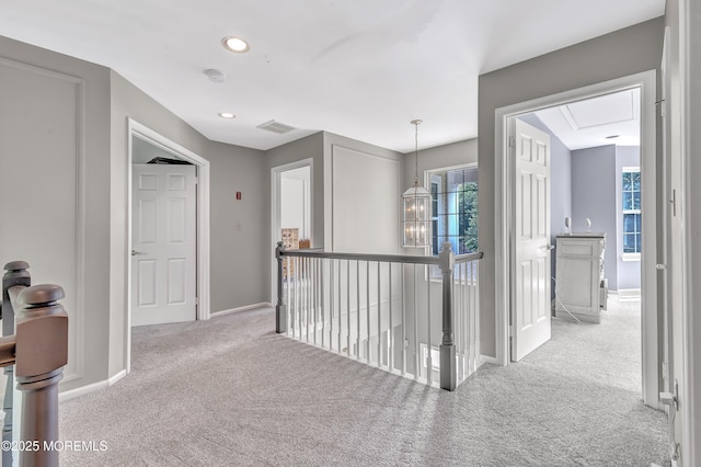 8 Armistead Ky, Colts Neck, NJ 07722 - corridor featuring carpet flooring, an upstairs landing, recessed lighting, and attic access