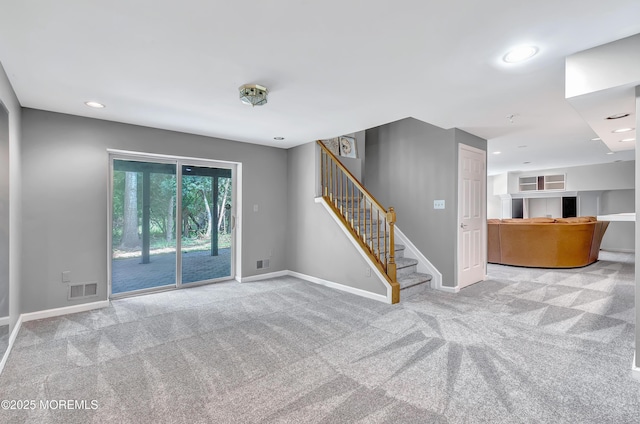 8 Armistead Ky, Colts Neck, NJ 07722 - unfurnished living room with carpet flooring, stairway, and recessed lighting