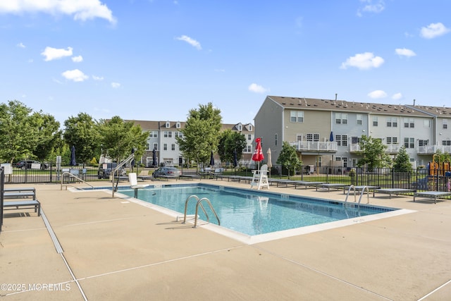 126 Waypoint Dr, Eatontown, NJ 07724 - community pool with a patio area and a residential view
