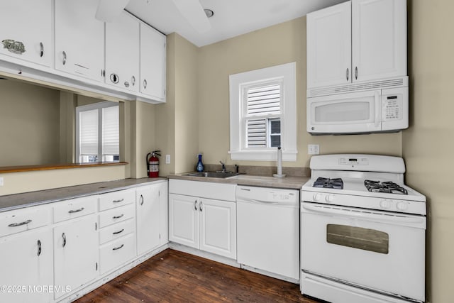 1103 A St, Belmar, NJ 07719 - kitchen with white appliances, white cabinets, dark wood-type flooring, and light countertops