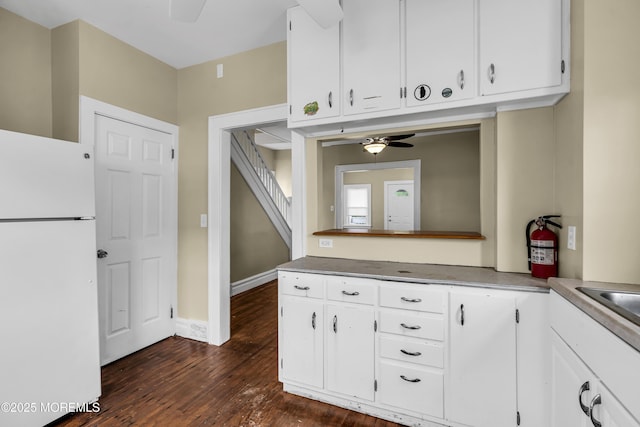 1103 A St, Belmar, NJ 07719 - kitchen with freestanding refrigerator, a ceiling fan, dark wood finished floors, and white cabinets