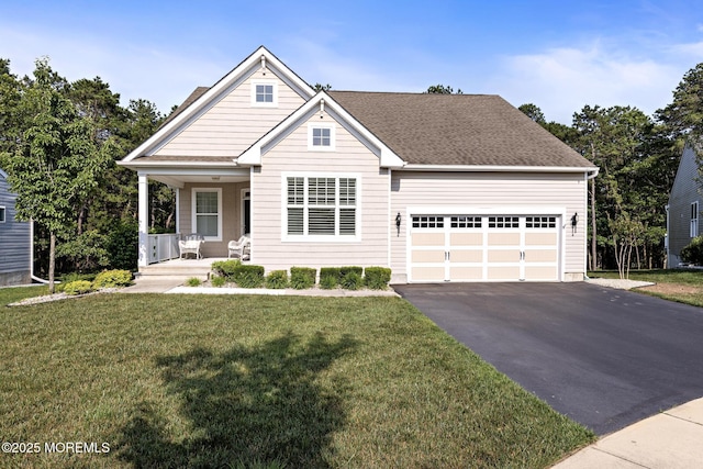 11 Starboard Ct, Little Egg Harbor, NJ 08087 - view of front of property featuring a porch, driveway, an attached garage, and a front yard