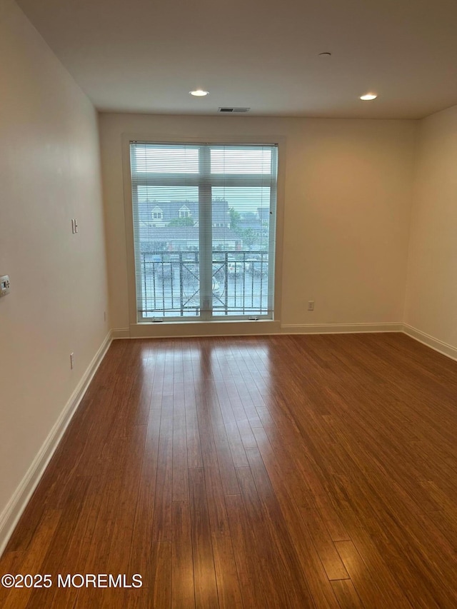 2346 Rte 33 Unit 205, Robbinsville, NJ 08691 - spare room with dark wood finished floors, healthy amount of natural light, and recessed lighting