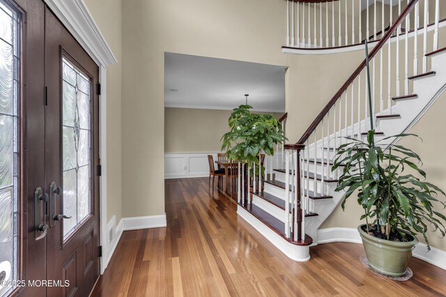 2 Michaels Ct, Jackson, NJ 08527 - foyer entrance featuring wood finished floors, stairs, a high ceiling, crown molding, and wainscoting