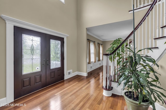 2 Michaels Ct, Jackson, NJ 08527 - foyer entrance with stairs, french doors, wood finished floors, crown molding, and a high ceiling