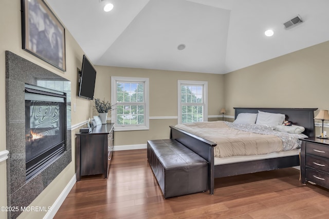 2 Michaels Ct, Jackson, NJ 08527 - bedroom with vaulted ceiling, a tiled fireplace, dark wood-style floors, and recessed lighting