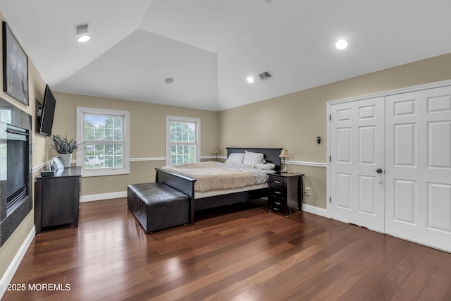 2 Michaels Ct, Jackson, NJ 08527 - bedroom with vaulted ceiling, dark wood-type flooring, and a glass covered fireplace