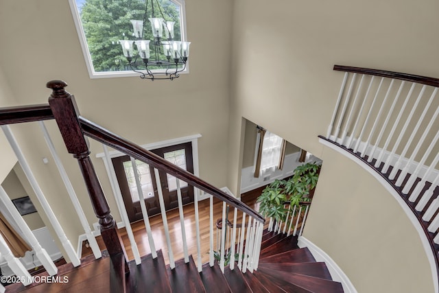 2 Michaels Ct, Jackson, NJ 08527 - staircase with a high ceiling, a chandelier, and wood finished floors