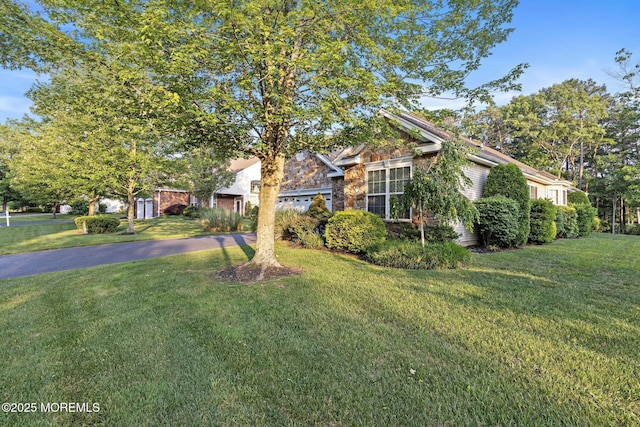 105 Golf View Dr, Little Egg Harbor, NJ 08087 - view of property hidden behind natural elements with a front yard, stone siding, and asphalt driveway