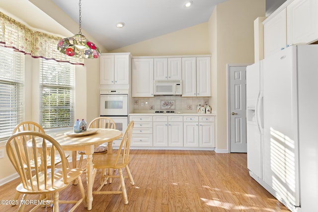 105 Golf View Dr, Little Egg Harbor, NJ 08087 - kitchen with white appliances, lofted ceiling, decorative backsplash, white cabinets, and light wood finished floors