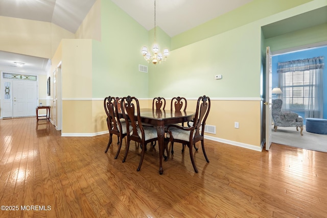 105 Golf View Dr, Little Egg Harbor, NJ 08087 - dining room featuring a chandelier, hardwood / wood-style floors, and high vaulted ceiling