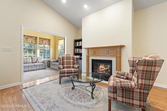 105 Golf View Dr, Little Egg Harbor, NJ 08087 - living room with a glass covered fireplace, high vaulted ceiling, wood finished floors, and recessed lighting