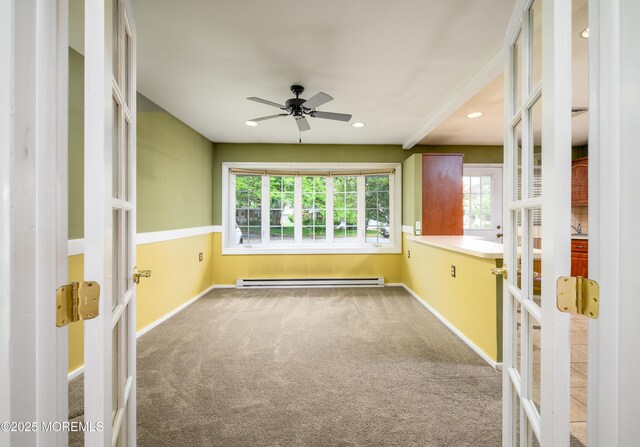 1161B Argyll Cir, Lakewood, NJ 08701 - spare room featuring french doors, a baseboard radiator, carpet flooring, a ceiling fan, and recessed lighting