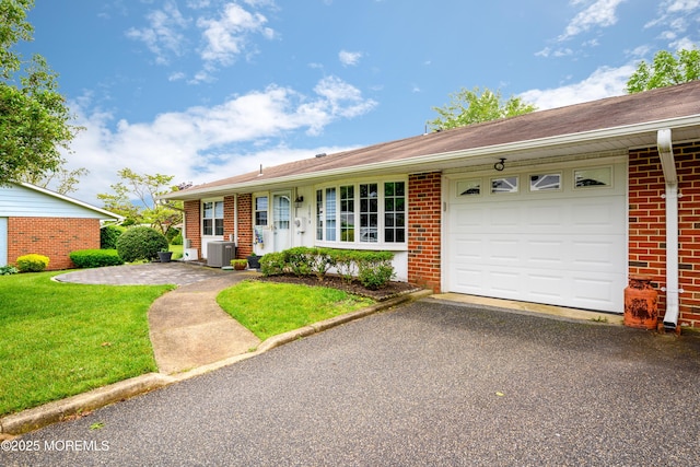1161B Argyll Cir, Lakewood, NJ 08701 - single story home with brick siding, an attached garage, asphalt driveway, and a front yard