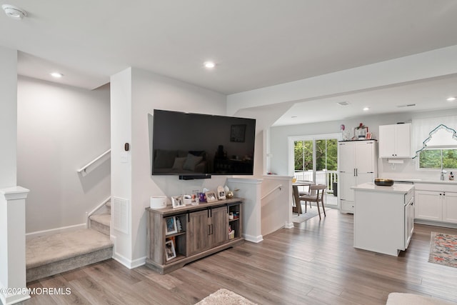404 Cyprus Ct, Forked River, NJ 08731 - living room featuring light wood-type flooring, plenty of natural light, recessed lighting, and stairs