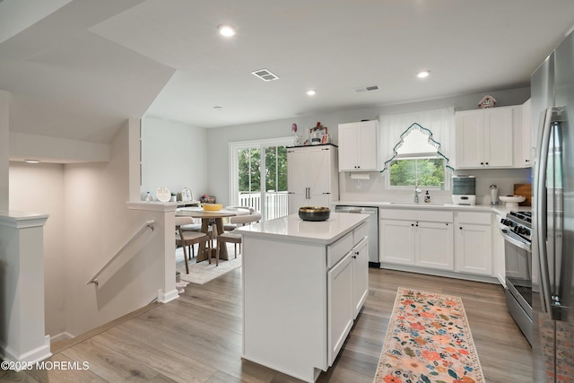 404 Cyprus Ct, Forked River, NJ 08731 - kitchen with appliances with stainless steel finishes, healthy amount of natural light, light countertops, white cabinets, and recessed lighting