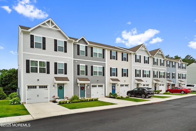 404 Cyprus Ct, Forked River, NJ 08731 - townhome / multi-family property featuring concrete driveway, a residential view, and a garage