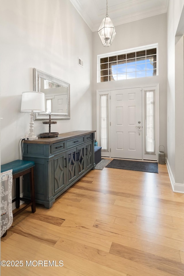 6 Cameron Ct, Forked River, NJ 08731 - foyer entrance featuring ornamental molding, light wood finished floors, and a high ceiling