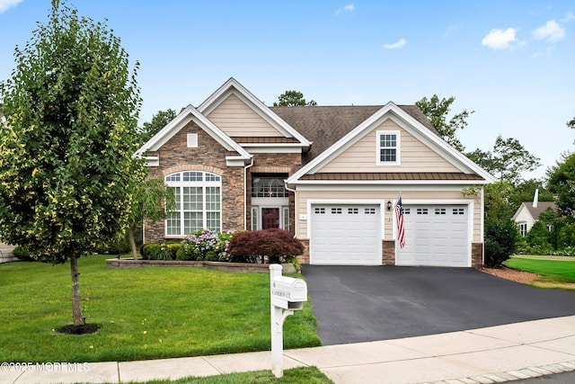 6 Cameron Ct, Forked River, NJ 08731 - view of front of house featuring stone siding, driveway, a standing seam roof, a front yard, and a metal roof