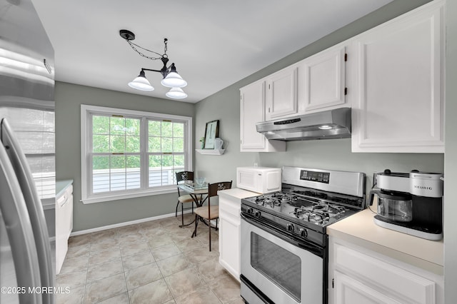 54 Chinkaberry Ct, Howell, NJ 07731 - kitchen with stainless steel range with gas stovetop, extractor fan, white microwave, a chandelier, and light countertops