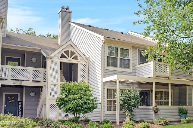 54 Chinkaberry Ct, Howell, NJ 07731 - view of property exterior featuring a chimney