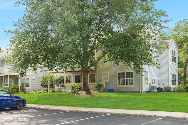54 Chinkaberry Ct, Howell, NJ 07731 - view of front of house with uncovered parking and a front yard