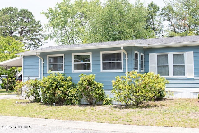 9 Casey Ct, Barnegat, NJ 08005 - view of front of home featuring an attached carport, a front lawn, and concrete driveway