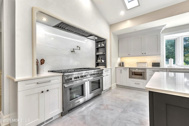 139 Stone Hill Rd, Colts Neck, NJ 07722 - kitchen with stainless steel appliances, tasteful backsplash, light marble finish floors, light stone counters, and white cabinets