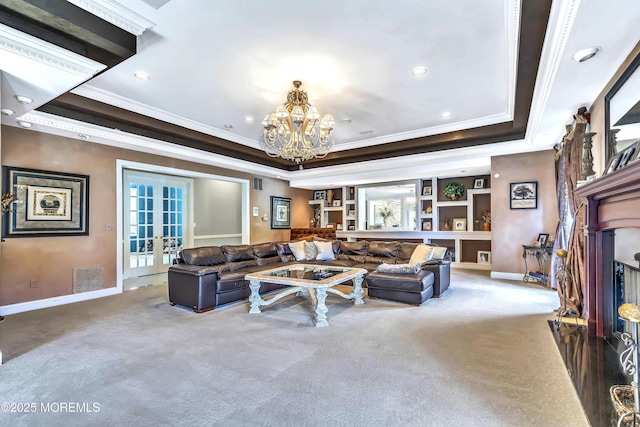 139 Stone Hill Rd, Colts Neck, NJ 07722 - carpeted living room with ornamental molding, a chandelier, a raised ceiling, french doors, and recessed lighting