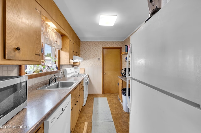 18 Slocum St, West Long Branch, NJ 07764 - kitchen featuring white appliances, under cabinet range hood, wallpapered walls, and backsplash