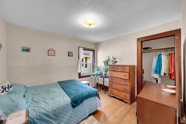 18 Slocum St, West Long Branch, NJ 07764 - bedroom featuring light wood finished floors, a closet, and an office area