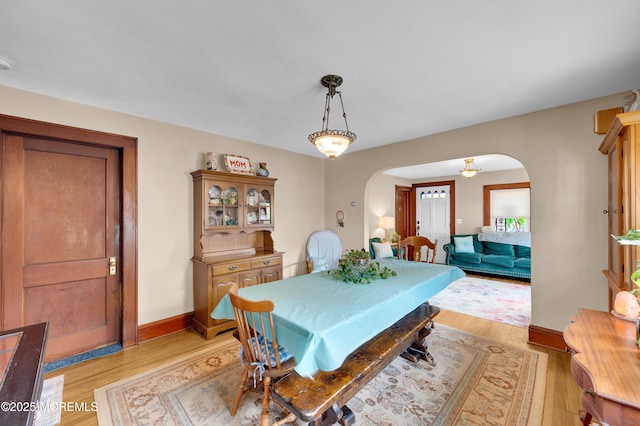 18 Slocum St, West Long Branch, NJ 07764 - dining area with arched walkways and light wood-type flooring