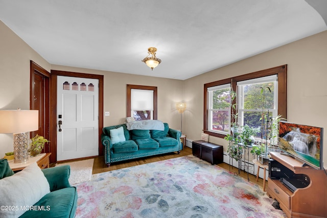 18 Slocum St, West Long Branch, NJ 07764 - living area with a baseboard heating unit and wood finished floors