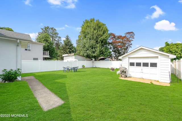 18 Slocum St, West Long Branch, NJ 07764 - fenced backyard featuring a garage and an outbuilding