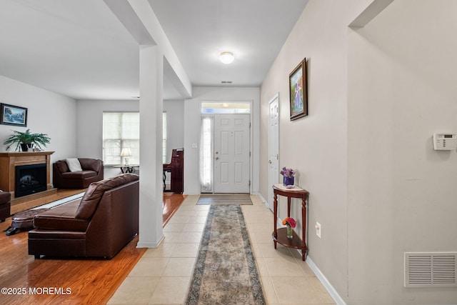 160 Kyle Ct Unit 160, Monroe, NJ 08831 - foyer with light tile patterned flooring and a fireplace