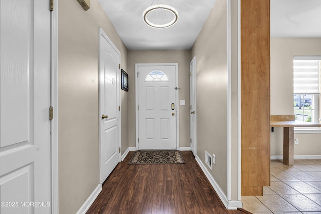 106 Aspen Ct, Lakewood, NJ 08701 - doorway with baseboards and wood finished floors