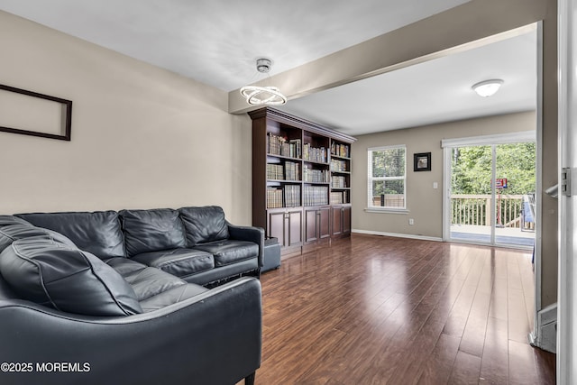 106 Aspen Ct, Lakewood, NJ 08701 - living room with dark wood-type flooring and baseboards