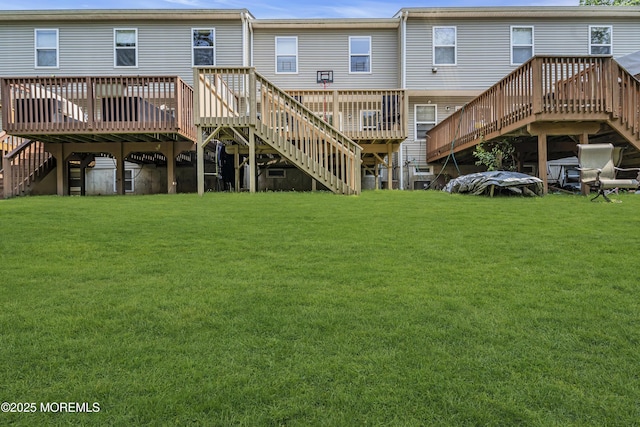 106 Aspen Ct, Lakewood, NJ 08701 - back of house featuring stairs, a wooden deck, and a lawn