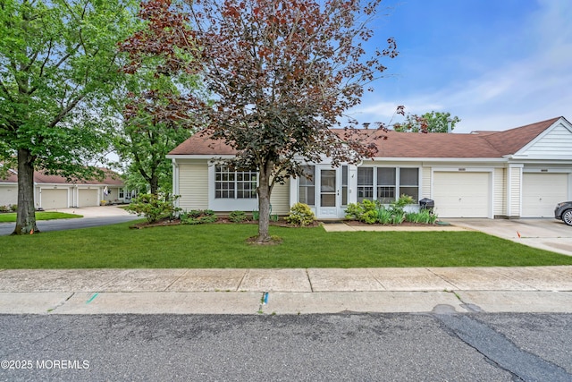 1091A Canterbury Dr, Manchester, NJ 08759 - view of front of home featuring an attached garage, a front yard, and concrete driveway