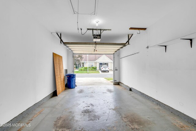 1091A Canterbury Dr, Manchester, NJ 08759 - garage featuring a garage door opener and baseboards