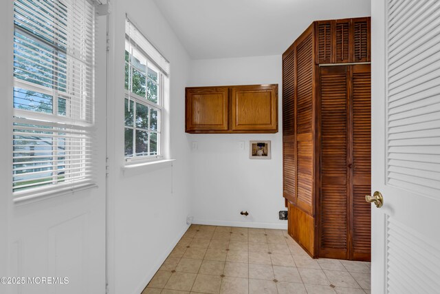 1091A Canterbury Dr, Manchester, NJ 08759 - laundry room featuring cabinet space, washer hookup, plenty of natural light, and light tile patterned flooring