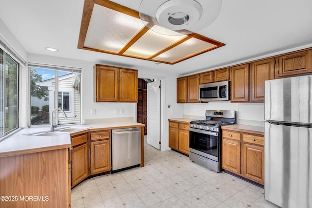 1091A Canterbury Dr, Manchester, NJ 08759 - kitchen featuring stainless steel appliances, light countertops, light flooring, brown cabinets, and recessed lighting