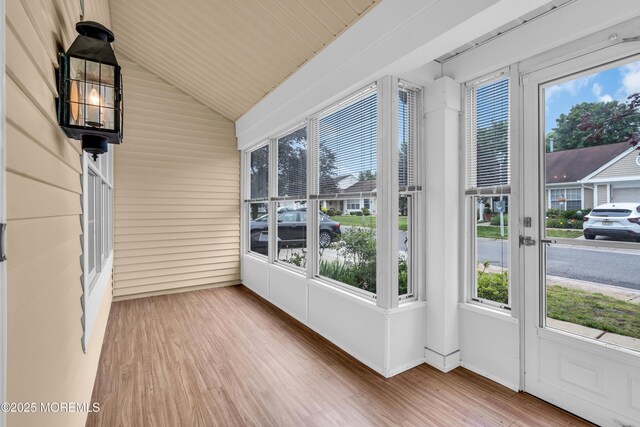 1091A Canterbury Dr, Manchester, NJ 08759 - unfurnished sunroom with wood finished floors and lofted ceiling