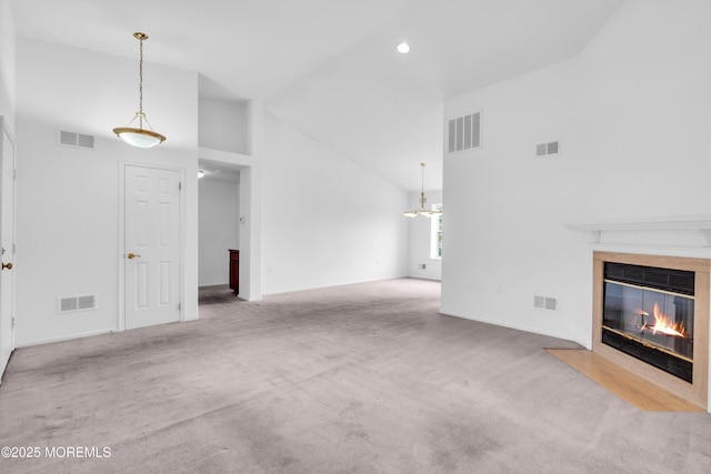 1091A Canterbury Dr, Manchester, NJ 08759 - unfurnished living room featuring high vaulted ceiling, a high end fireplace, a chandelier, and carpet flooring