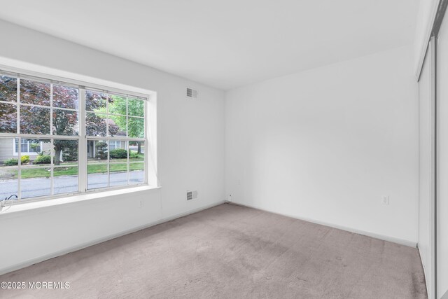 1091A Canterbury Dr, Manchester, NJ 08759 - unfurnished room featuring light colored carpet and baseboards