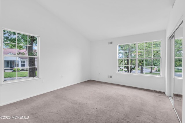 1091A Canterbury Dr, Manchester, NJ 08759 - carpeted spare room with vaulted ceiling and baseboards