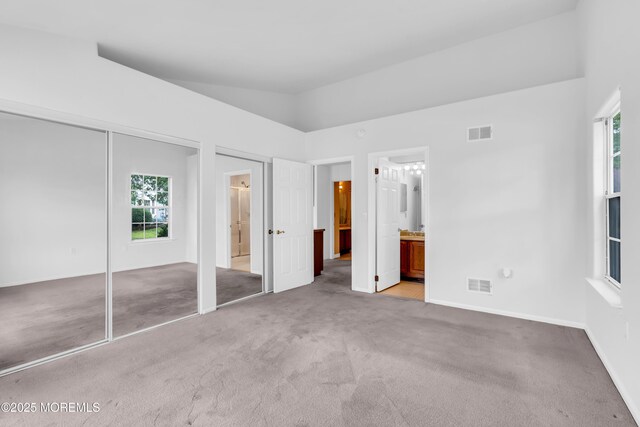 1091A Canterbury Dr, Manchester, NJ 08759 - unfurnished bedroom with light carpet and ensuite bathroom