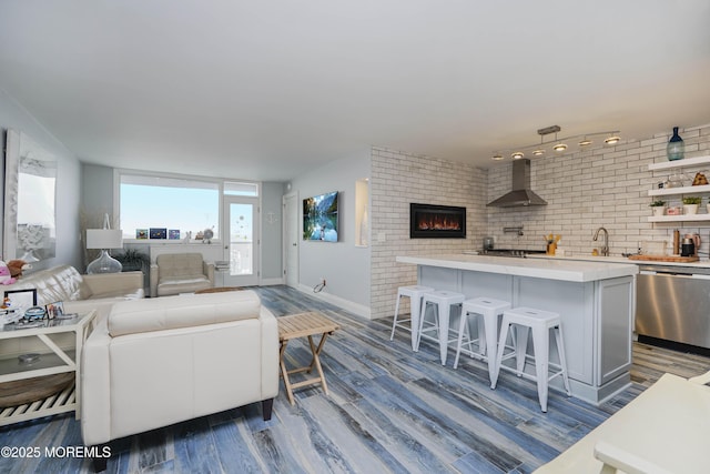 675 Ocean Ave Unit 5J, Long Branch, NJ 07740 - living area featuring dark wood-style flooring and a lit fireplace