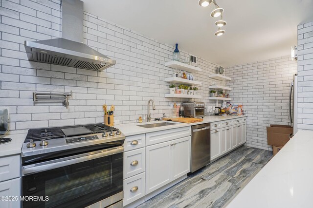 675 Ocean Ave Unit 5J, Long Branch, NJ 07740 - kitchen featuring appliances with stainless steel finishes, wall chimney range hood, light countertops, and wood finished floors